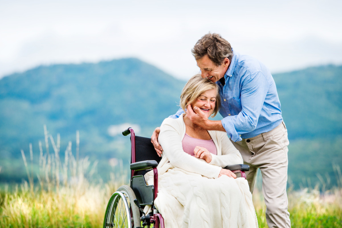 Senior Man with a Women in A Wheelchair