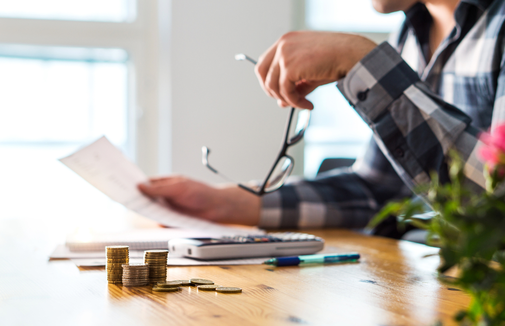 person looking over financial paperwork