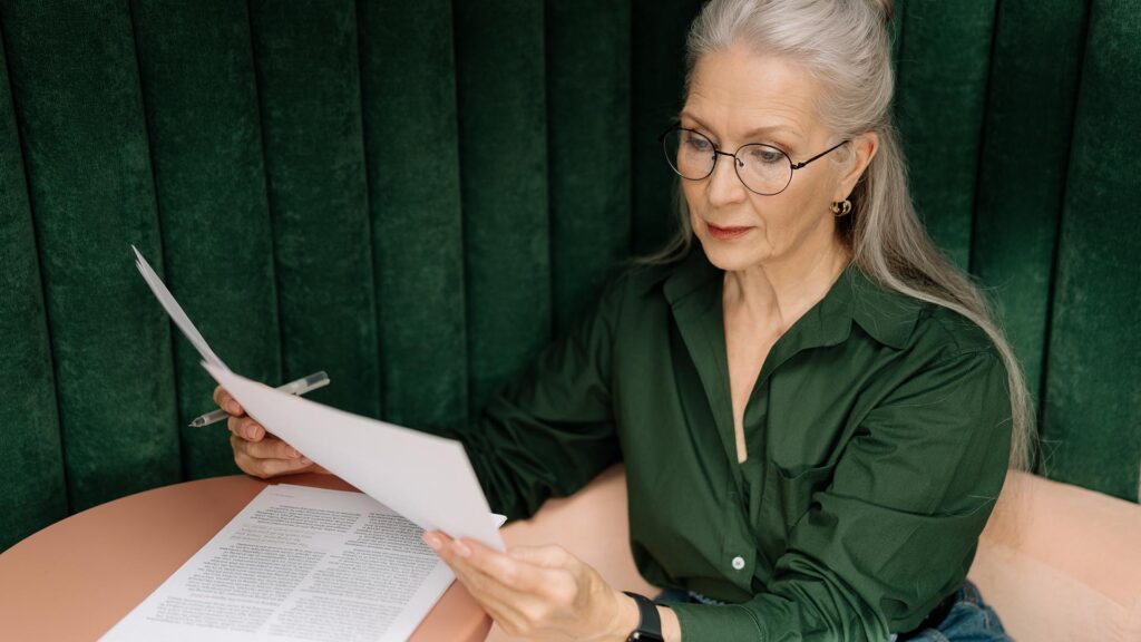 woman looking over documents